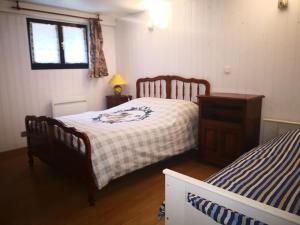 a bedroom with two beds and a window at Apartment 20mns from Paris in La Ville-du-Bois