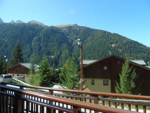 a view of a mountain from a wooden balcony at Appartement Modane, 3 pièces, 6 personnes - FR-1-561-110 in Modane