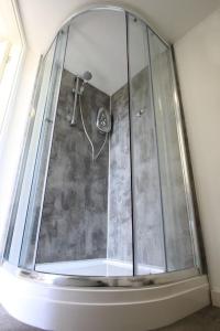 a shower with a glass enclosure in a bathroom at Orchard Nook - Sleeps 4, 2 Bedrooms (one ensuite) in Kendal