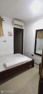 Letto o letti in una camera di BEN AUTO Hotel
