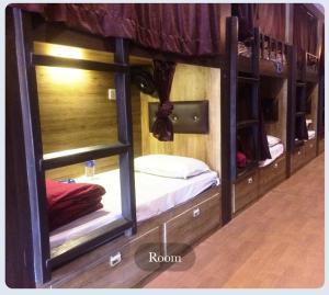 a room with two bunk beds in it at Hilal dormitory in Mumbai