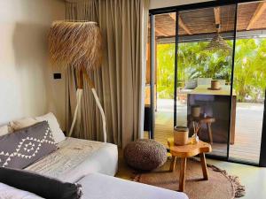 Postel nebo postele na pokoji v ubytování Le Bungalow Gypset