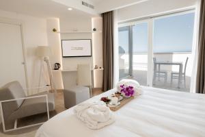 מיטה או מיטות בחדר ב-San Lorenzo Boutique Hotel & SPA