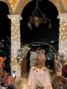a bride and groom cutting their wedding cake at Villa Gelsomino Exclusive House in Santa Margherita Ligure