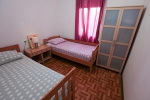 Postel nebo postele na pokoji v ubytování Apartment Sarita