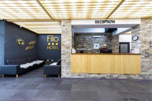 a lobby of a hotel with a reception desk at Filo Hotel Wellness & Spa in Gheorgheni +76 photos
