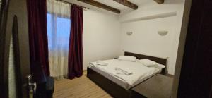 Postel nebo postele na pokoji v ubytování Hotel Bran Stoker