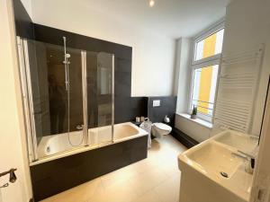 Koupelna v ubytování Park Lane Business-Apartment + 8 fotografií