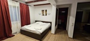 Postel nebo postele na pokoji v ubytování Hotel Bran Stoker