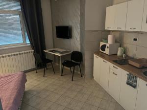 Kuchyň nebo kuchyňský kout v ubytování MAGIC M Apartment