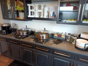 a kitchen counter with two pots and pans on it at Bunk House in Madras