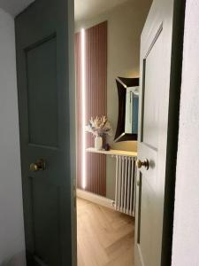 an open door to a room with a hallway with at Lunaria in Pisa