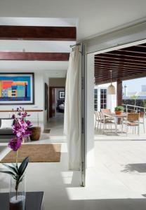a living room with a sliding glass door to a house at Villa Perla in Puerto del Carmen