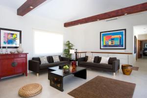 a living room with two couches and a coffee table at Villa Perla in Puerto del Carmen