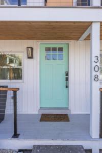 a front door of a house with a blue door at Beach Block-1min Walk-Luxury-The Reef Downstairs in Ocean City