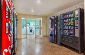 a room with two vending machines with soda and drinks at Extended Stay America Select Suites - Atlanta - Alpharetta in Alpharetta