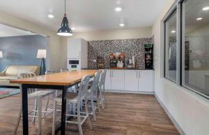 a kitchen and dining room with a table and chairs at Extended Stay America Suites - Atlanta - Lithia Springs in Lithia Springs