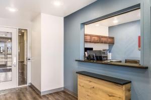 a kitchen with a counter and a window at WoodSpring Suites Bentonville in Bentonville +7 photos