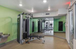 a gym with green walls and tread machines at Extended Stay America Suites - Boston - Saugus in Saugus