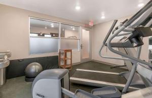 a room with a gym with a treadmill and a window at Extended Stay America Select Suites - Louisville - Airport in Louisville