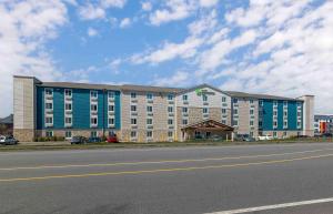 a large building on the side of a road at Extended Stay America Suites - Nashua - Merrimack in Merrimack