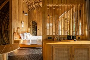 Postel nebo postele na pokoji v ubytování Jungleight Bali