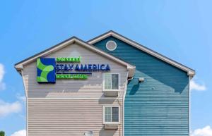 a building with a stay america sign on it at Extended Stay America Select Suites - Pensacola - Northwest in Pensacola