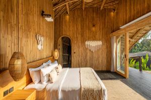 Postel nebo postele na pokoji v ubytování Jungleight Bali