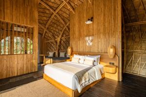 Postel nebo postele na pokoji v ubytování Jungleight Bali