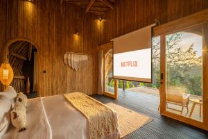 Postel nebo postele na pokoji v ubytování Jungleight Bali
