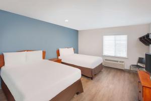 Krevet ili kreveti u jedinici u objektu Extended Stay America Select Suites - Springdale