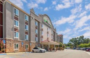 a hotel with a car parked in front of it at Extended Stay America Suites - Redlands in Redlands