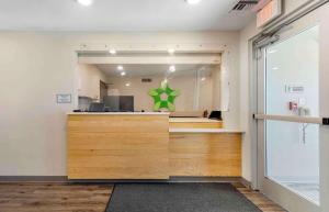 a store front with a green dress in the window at Extended Stay America Suites - Redlands in Redlands