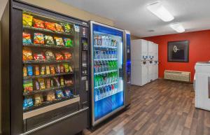 a store with a large refrigerator filled with drinks at Extended Stay America Suites - Jacksonville - Camp Lejeune in Jacksonville