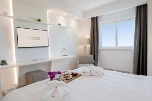 מיטה או מיטות בחדר ב-San Lorenzo Boutique Hotel & SPA
