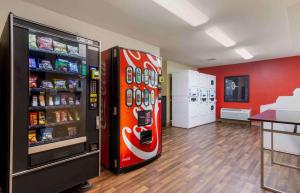 a coca cola refrigerator in a room with a store at Extended Stay America Select Suites - Atlanta - Marietta - Windy Hill in Atlanta
