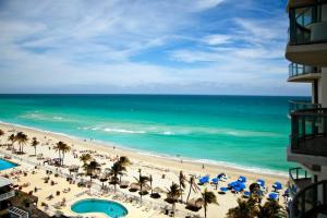 a view of the beach from the balcony of a resort at Marenas Beach Resort in Sunny Isles Beach
