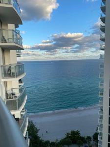 a view of the ocean from between two buildings at Marenas Beach Resort in Sunny Isles Beach