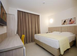 Postel nebo postele na pokoji v ubytování Pena Branca Hotel e Eventos + 37 fotografií
