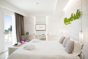 מיטה או מיטות בחדר ב-San Lorenzo Boutique Hotel & SPA