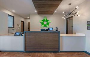 a lobby with a reception desk with a star on the wall at Extended Stay America Premier Suites - Melbourne - Palm Bay in West Melbourne