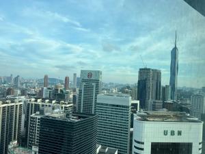 a view of a city skyline with skyscrapers at Vortex suites klcc by Hafizah suites in Kuala Lumpur