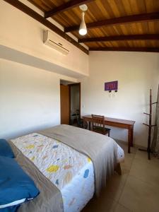 Postel nebo postele na pokoji v ubytování Casa alto do pontal