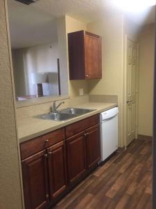 a kitchen with a sink and a counter top at Extended Stay America Suites - Jacksonville - Deerwood Park in Jacksonville