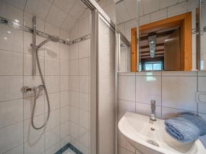 a bathroom with a sink and a shower at Hilde 1 in Kirchdorf in Tirol