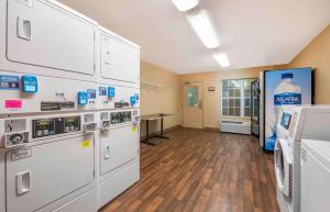 a large room with white appliances in a pharmacy at Extended Stay America Suites - Gainesville - I-75 in Gainesville