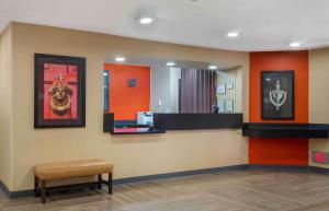 a waiting room with a bench and a mirror at Extended Stay America Suites - St Petersburg - Clearwater - Executive Dr in Clearwater