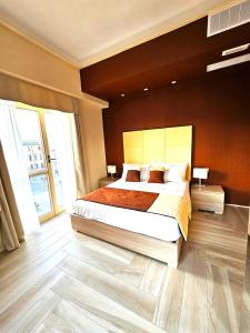 Postel nebo postele na pokoji v ubytování Trilogy Prestige - Central Premium Suites