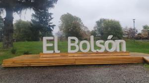 a sign that says el boston in a park at Sur tiny house in El Bolsón