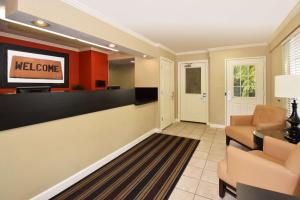 a lobby with a waiting room with a television at Extended Stay America Suites - Fort Lauderdale - Davie in Davie